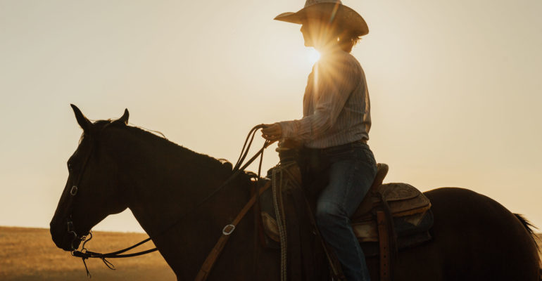 Woman rancher on horseback