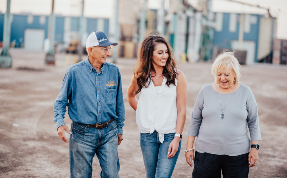 Assali family walking through processing facility