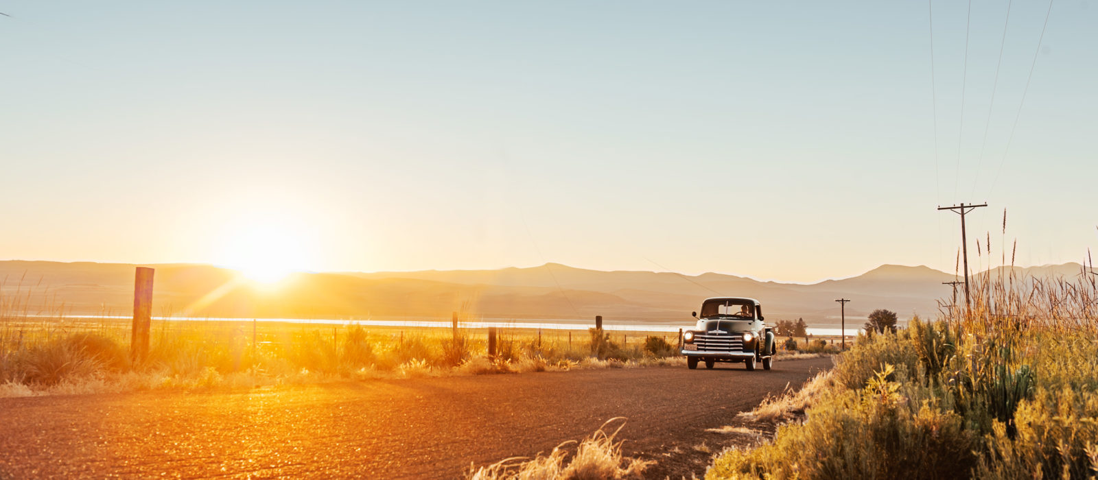 American AgCredit truck on country road at sunset