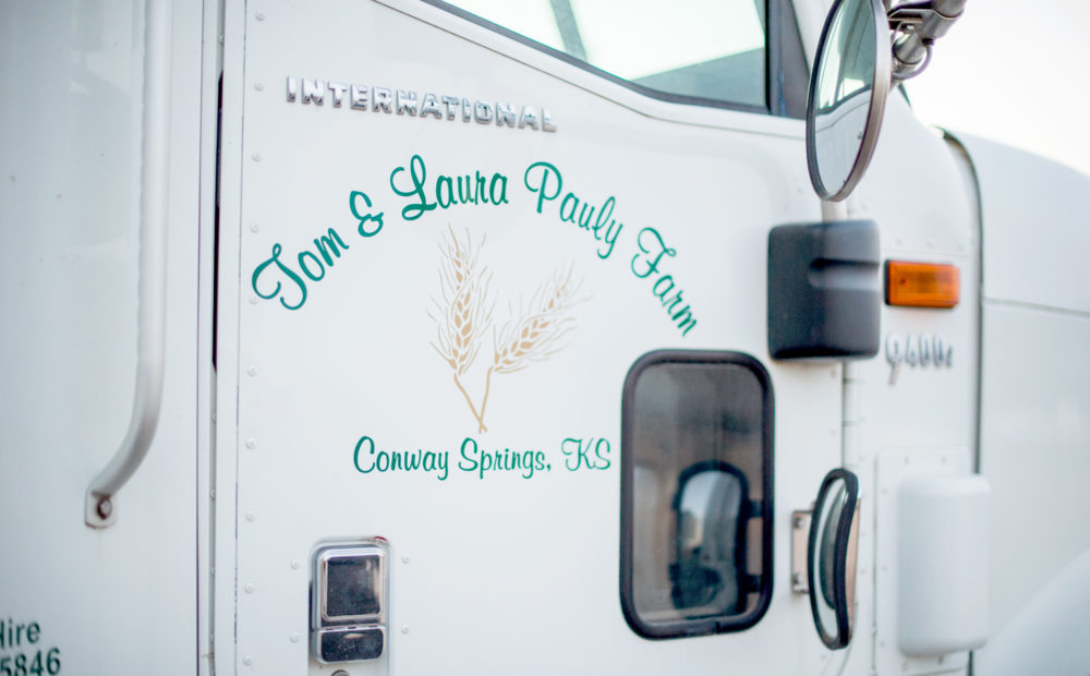 detail of Pauly Farm truck door with logo