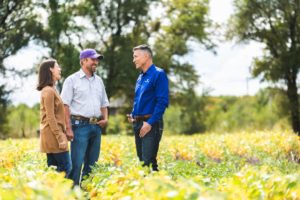 Gerry Mills talking with Dennis and Jessica Rau