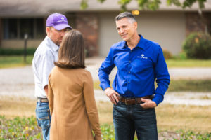 American AgCredit Lender with Customers in a soybean field