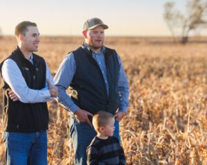Lender talking with Farmer; Logan Lix and Bradon Wiens