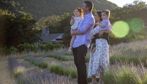 Young family standing in Lavender field