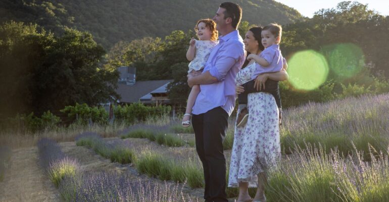Young family standing in Lavender field